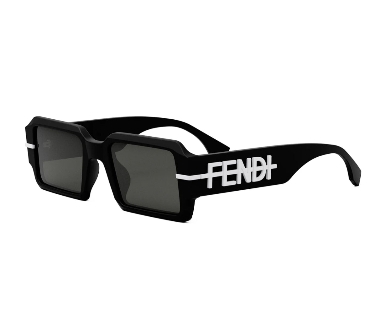 Black sunglasses with 'Fendi' branding on a white background