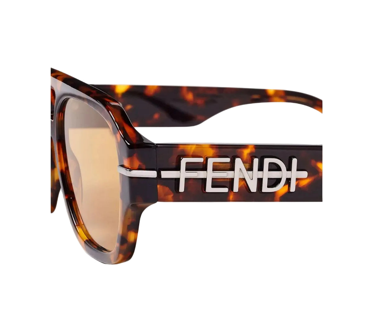 Fendi sunglasses with tortoiseshell frame and brown lenses on a white background
