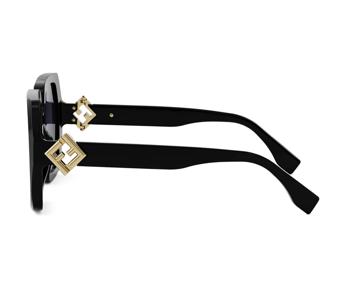 Black sunglasses with gold accents on a white background