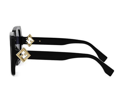 Black sunglasses with gold accents on a white background