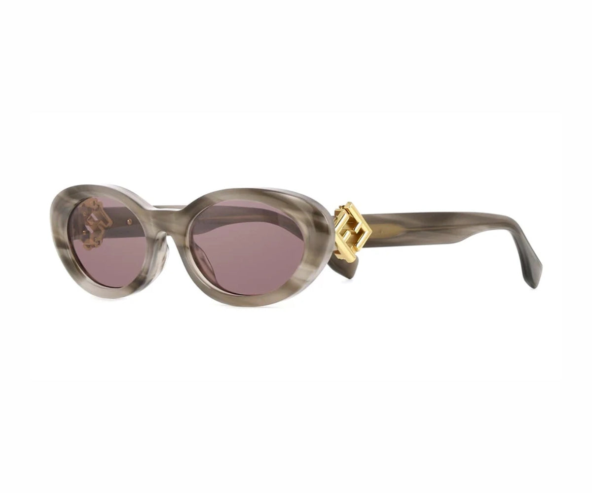 Sunglasses with a gold accent on a white background