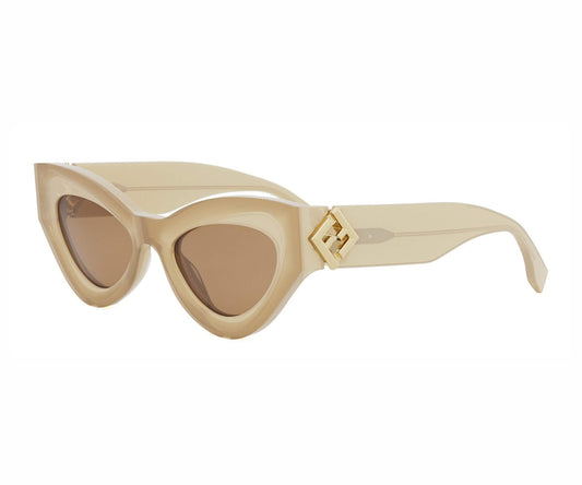 Beige sunglasses with a brown lens on a white background