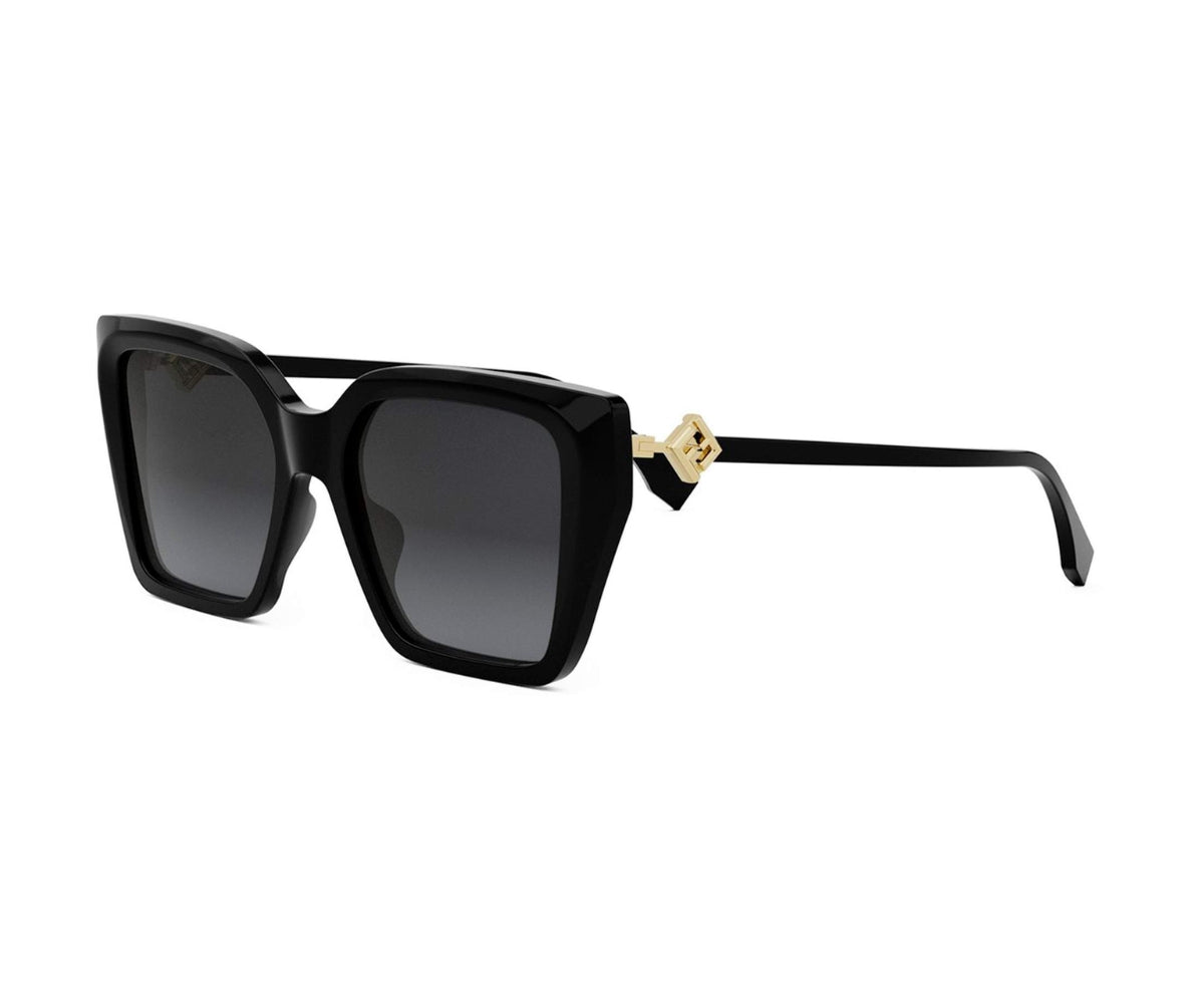 Black sunglasses with gold accents on a white background