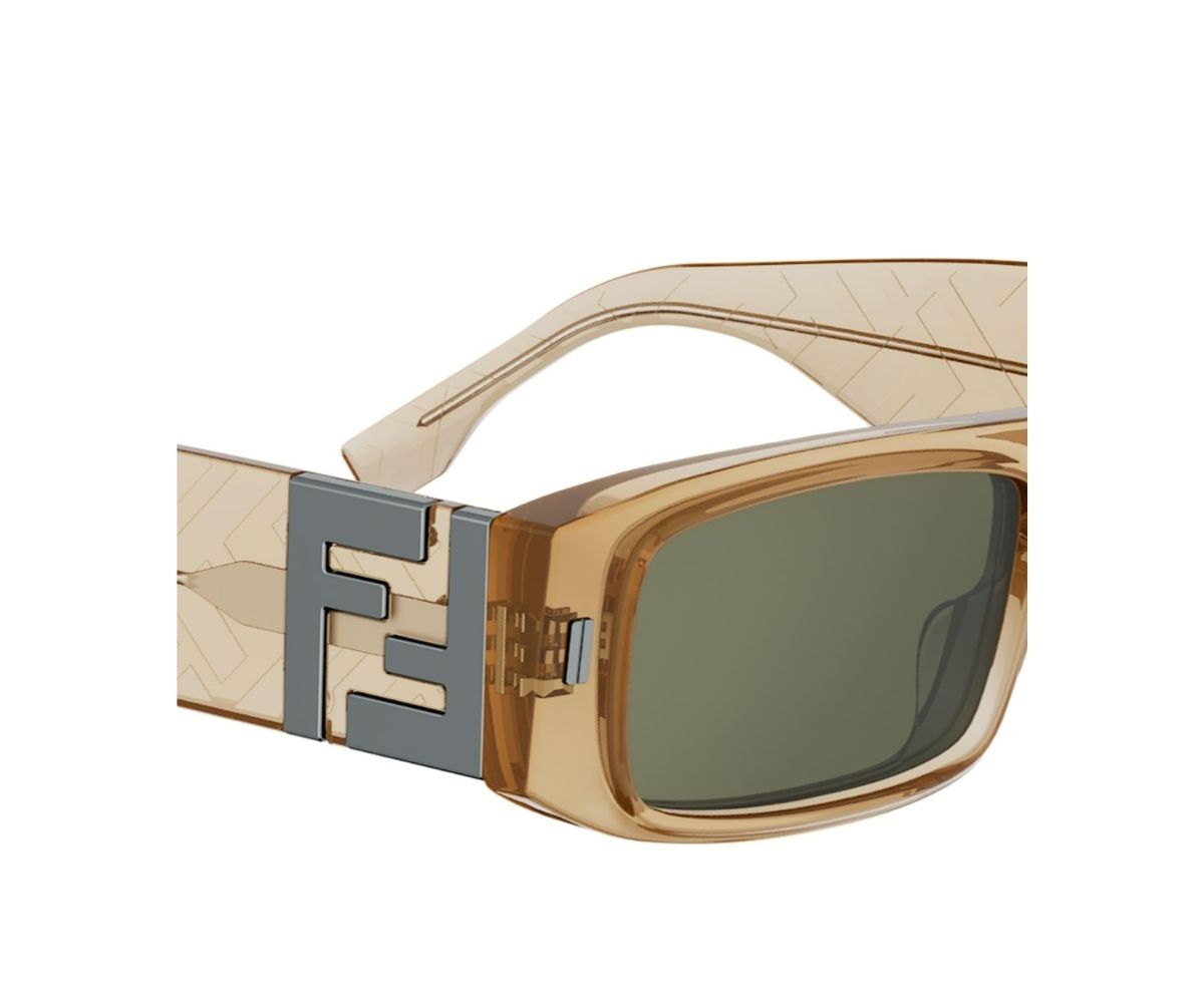 Gold sunglasses with a prominent logo on a white background