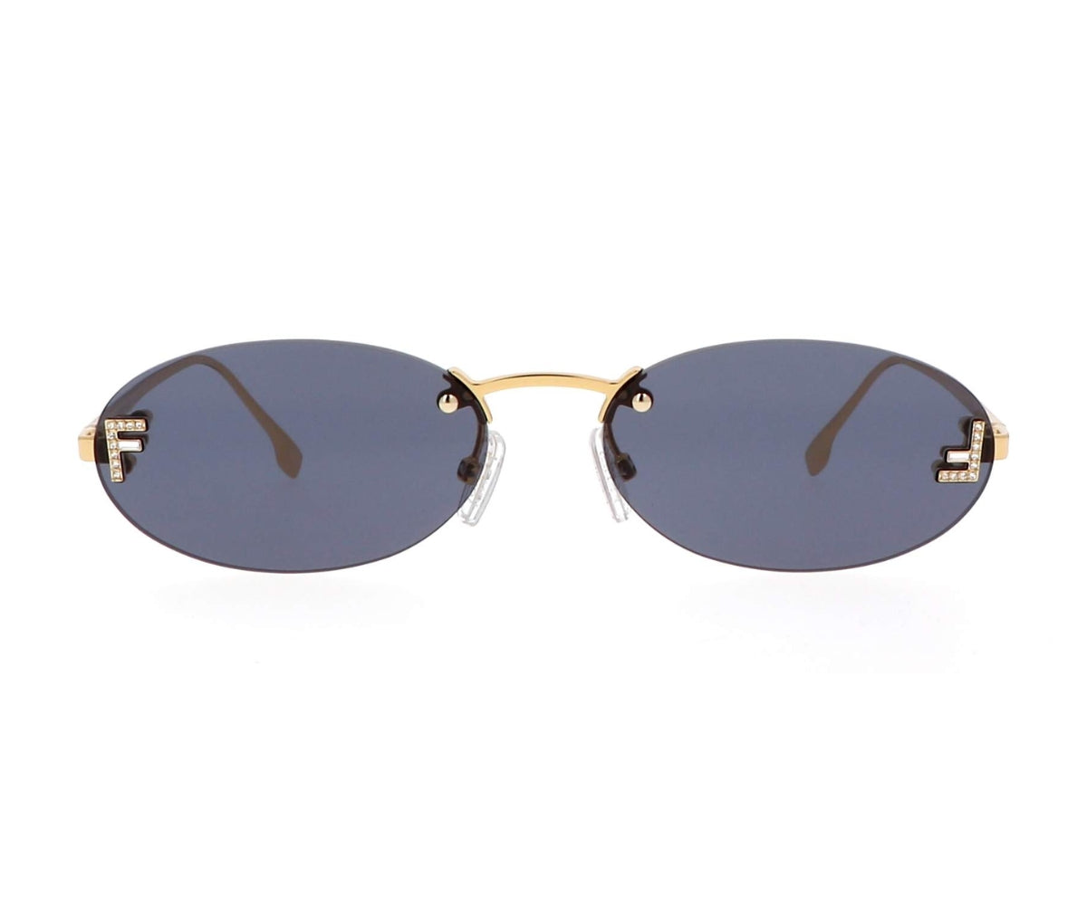 Sunglasses with gold frame and dark lenses on a white background