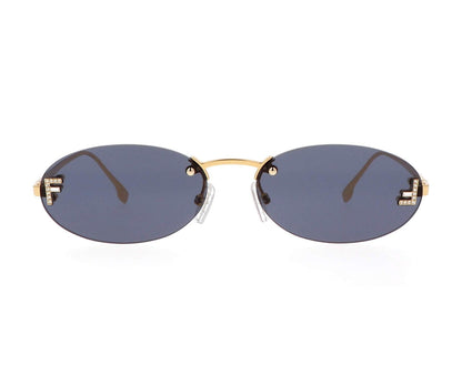 Sunglasses with gold frame and dark lenses on a white background