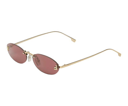 Gold-framed sunglasses with pink lenses on a white background