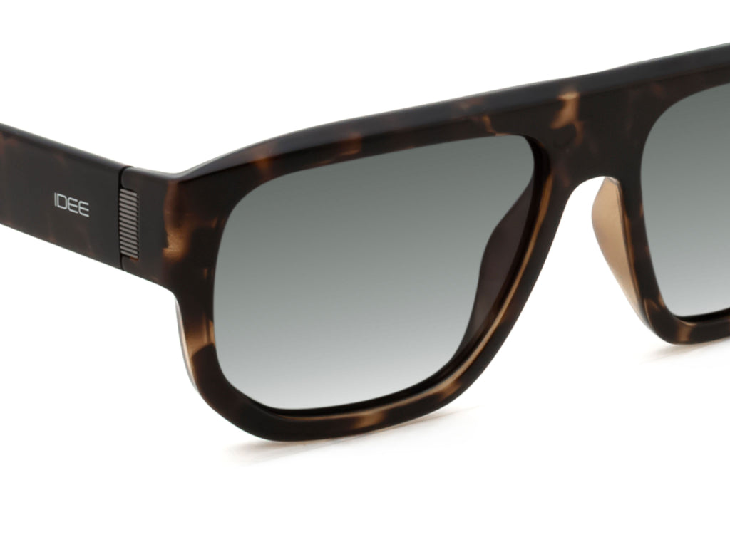 Sunglasses with tortoiseshell frame and gradient lenses on a white background