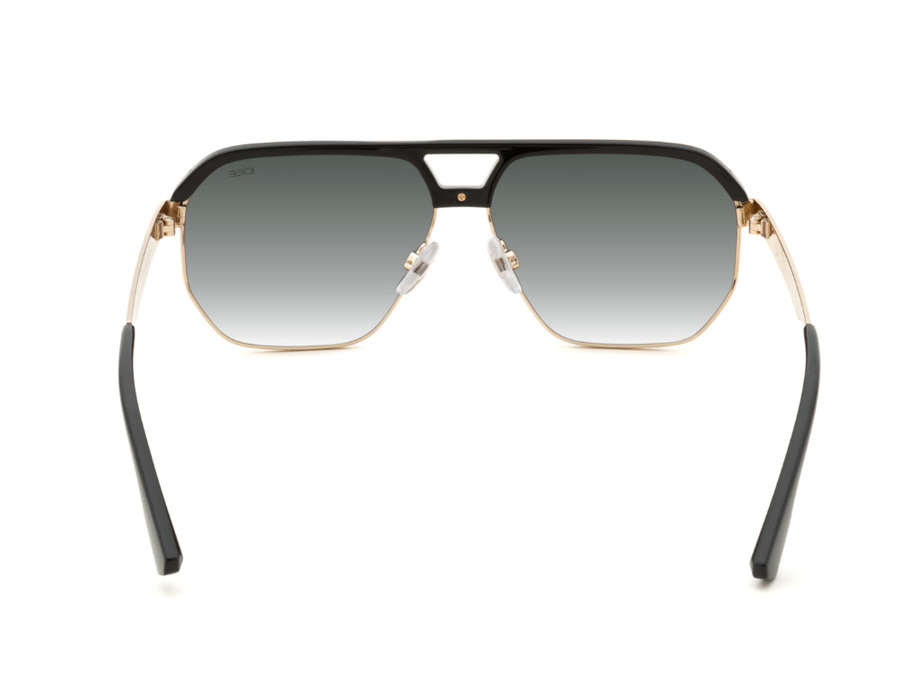 Sunglasses with black and gold frame on a white background
