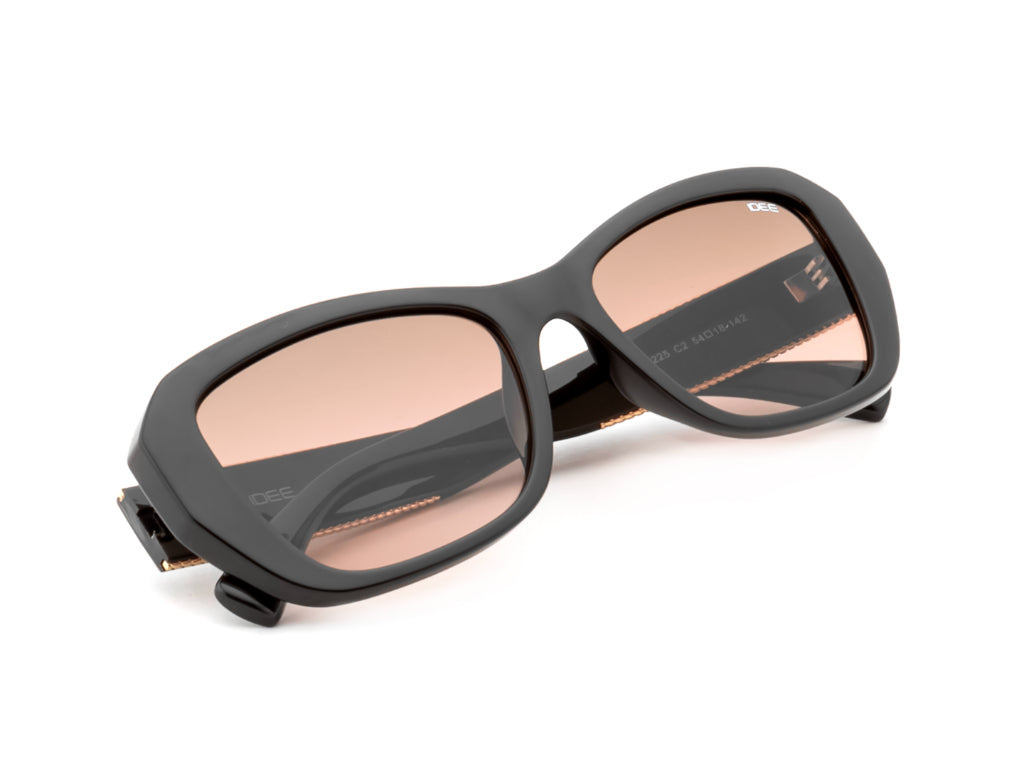 Black sunglasses with pink-tinted lenses on a white background