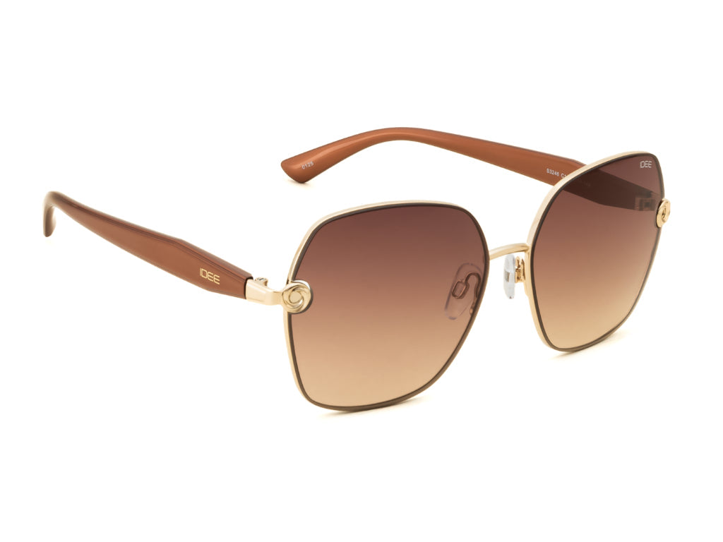 Sunglasses with brown gradient lenses and gold frame on a white background