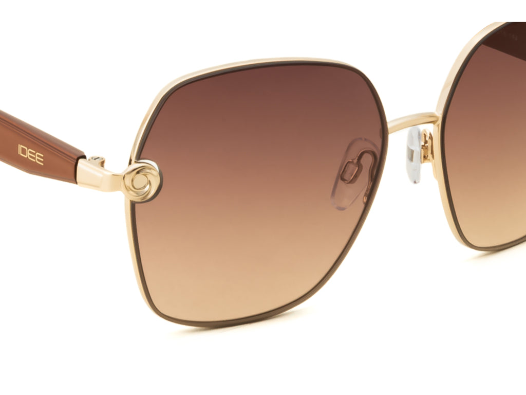Sunglasses with gold frame and brown gradient lenses on a white background