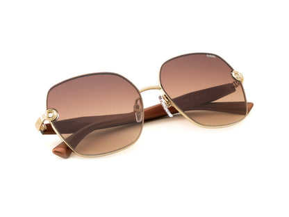 Sunglasses with brown gradient lenses and gold frames on a white background