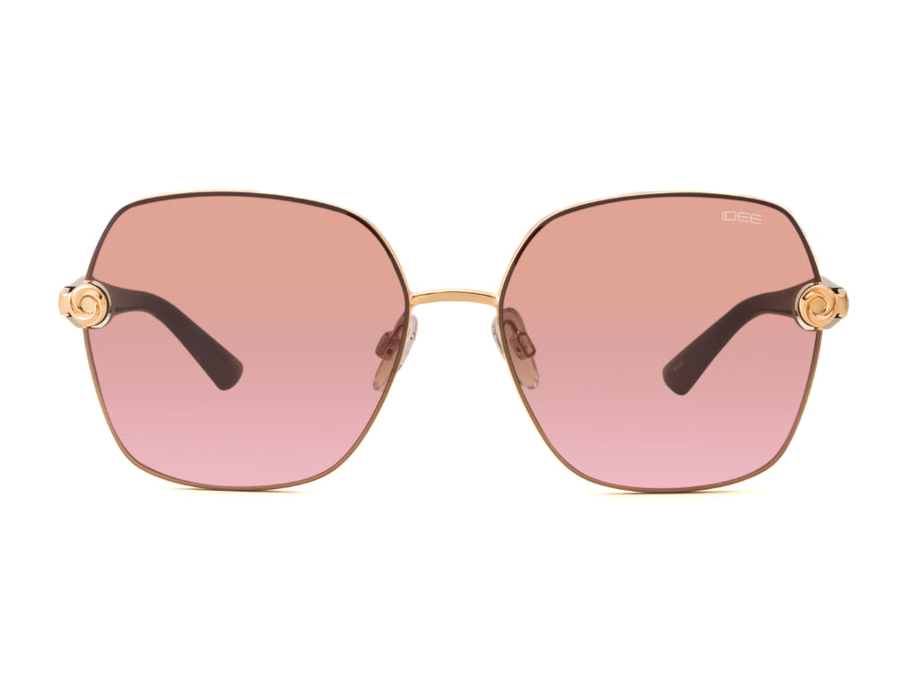 Sunglasses with pink gradient lenses and gold frames on a white background