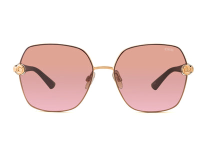 Sunglasses with pink gradient lenses and gold frames on a white background