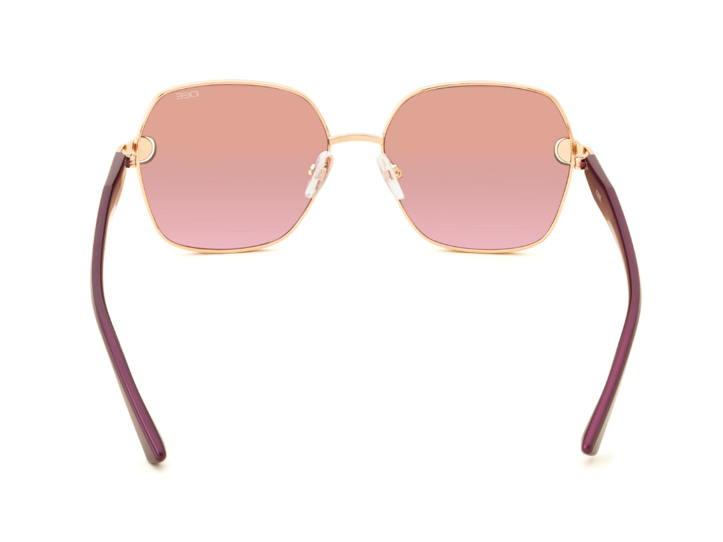 Sunglasses with pink lenses and purple frames on a white background