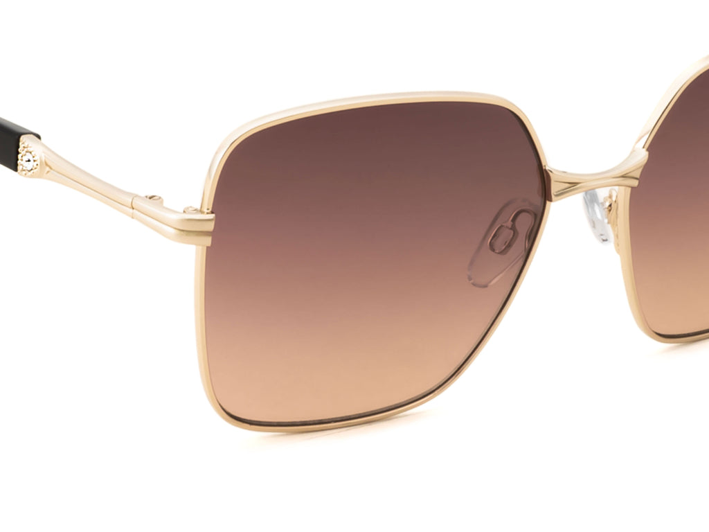 Gold-framed sunglasses with brown gradient lenses on a white background