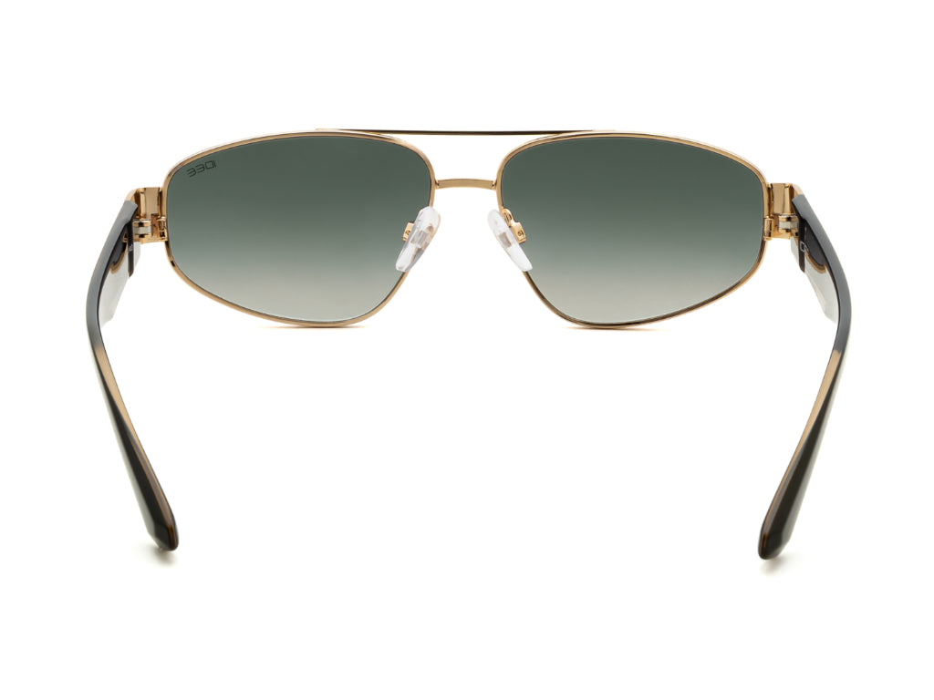 Sunglasses with gold frame and black arms on a white background
