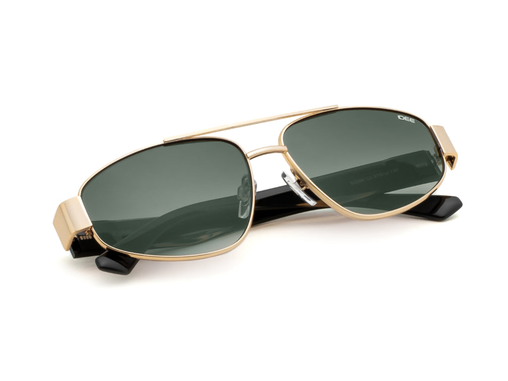 Gold-framed sunglasses with green lenses on a white background