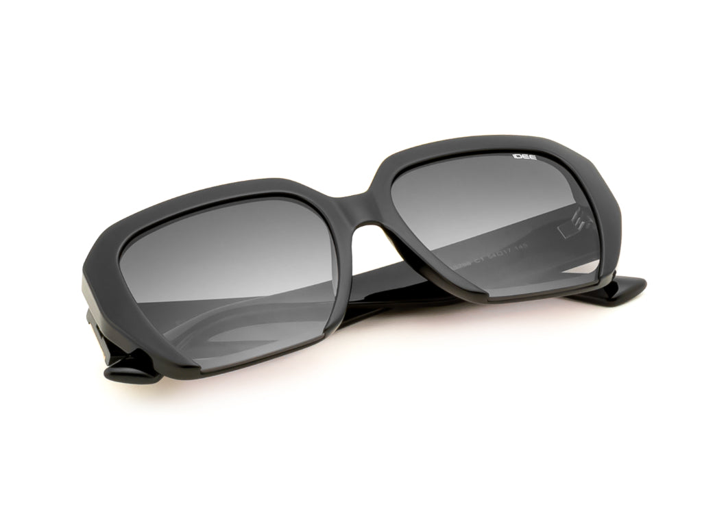 Black sunglasses with dark lenses on a white background