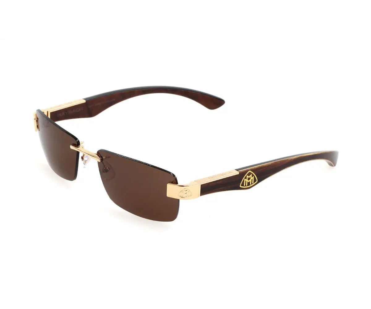 Sunglasses with gold frame and brown lenses on a white background