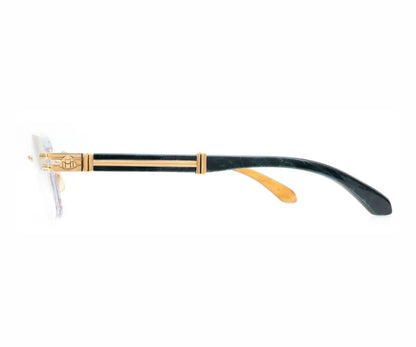 Gentleman's razor with gold and black handle on a white background