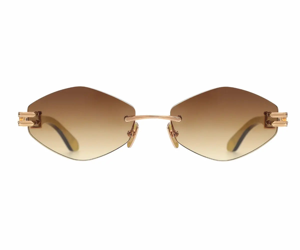Gold-rimmed sunglasses with gradient lenses on a white background