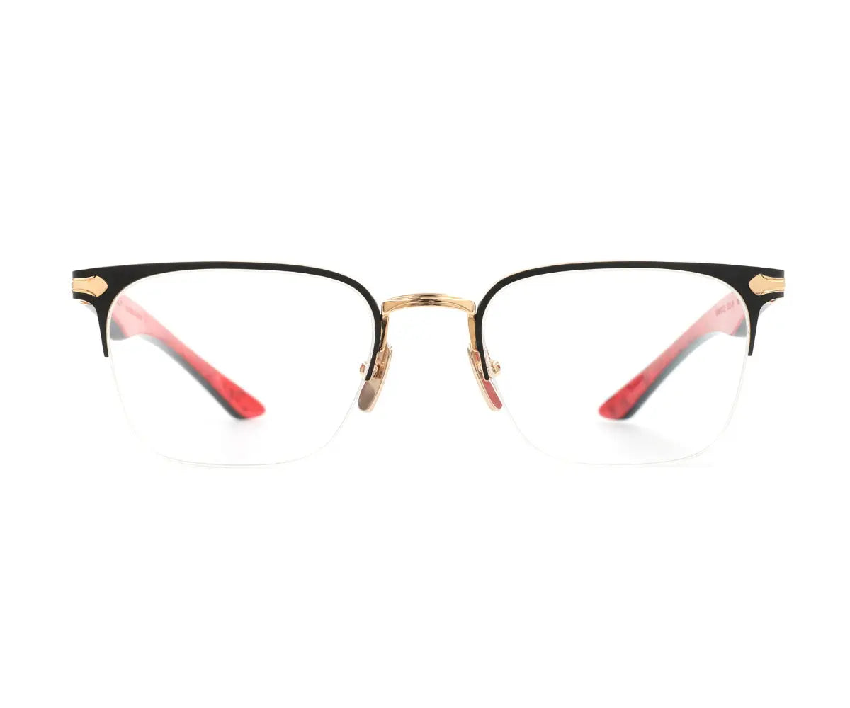 Eyeglasses with black, gold, and red frame on a white background