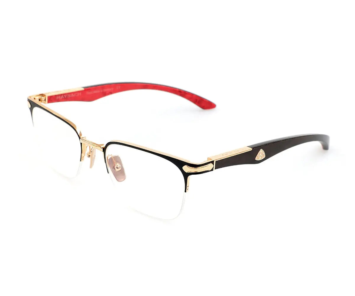 Eyeglasses with gold and black frame on a white background
