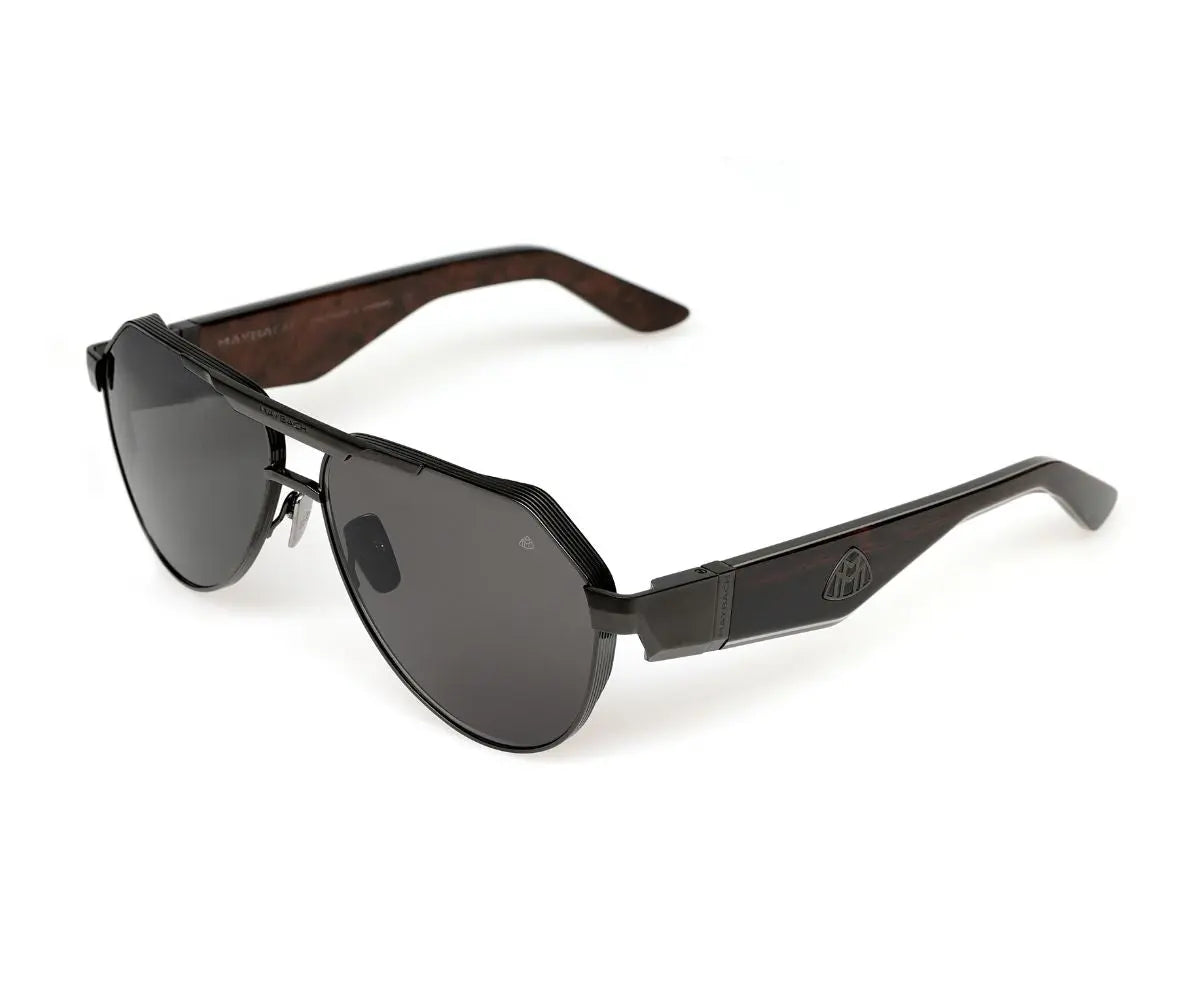 Sunglasses with dark lenses and wooden frame on a white background