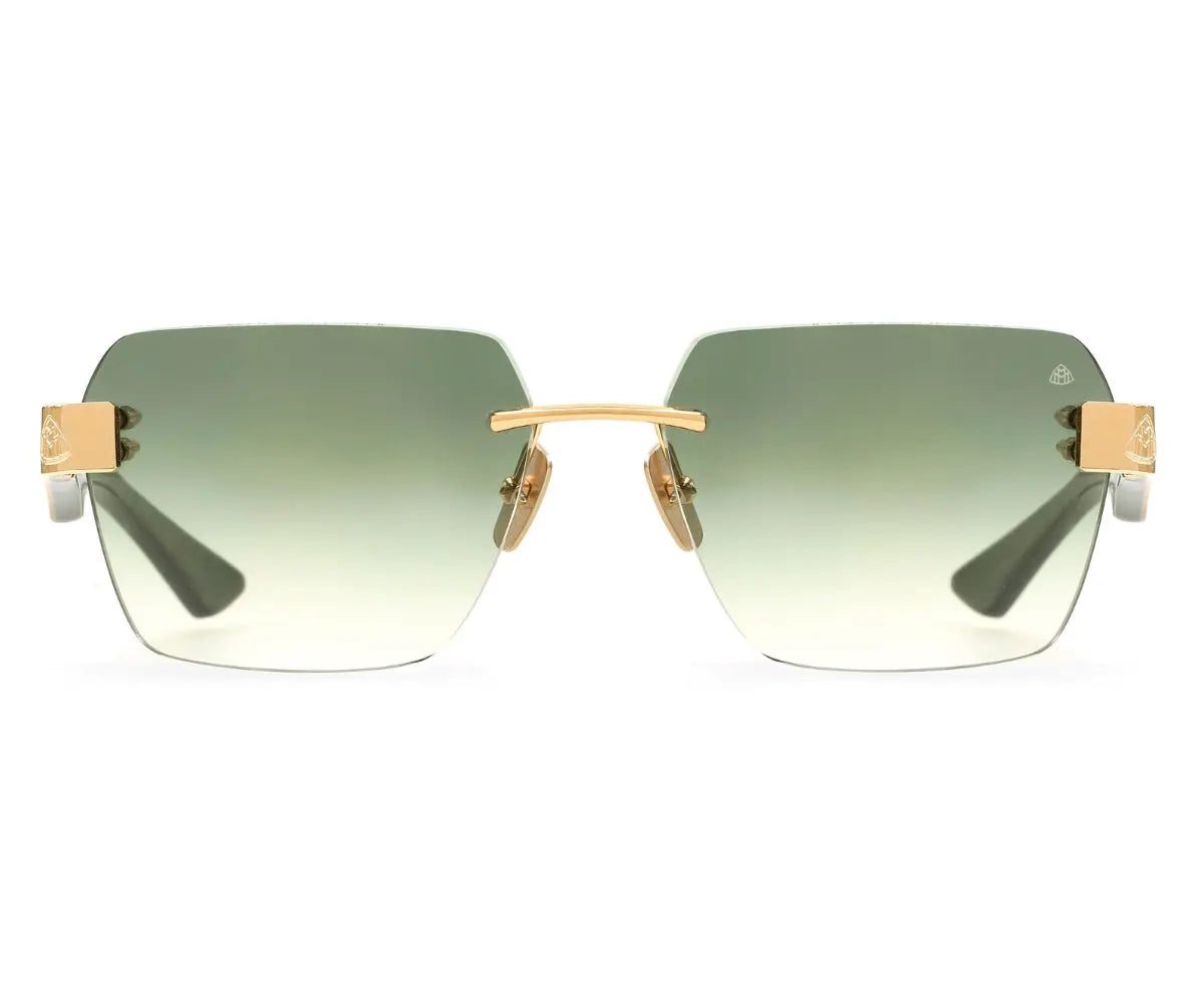 Sunglasses with gold frame and green gradient lenses on a white background