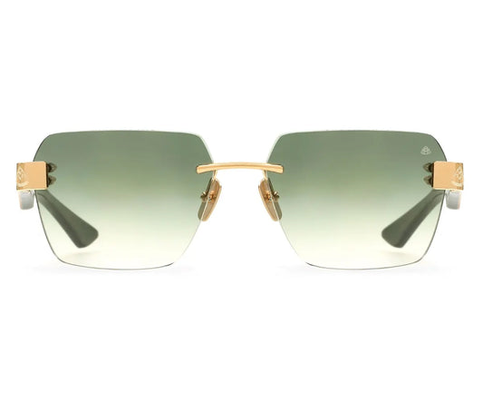 Sunglasses with gold frame and green gradient lenses on a white background