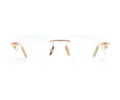 Clear eyeglasses with gold frames on a white background
