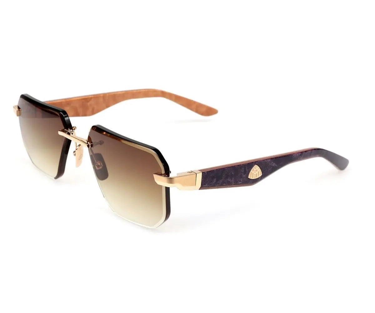 Sunglasses with gradient lenses and gold frame on a white background