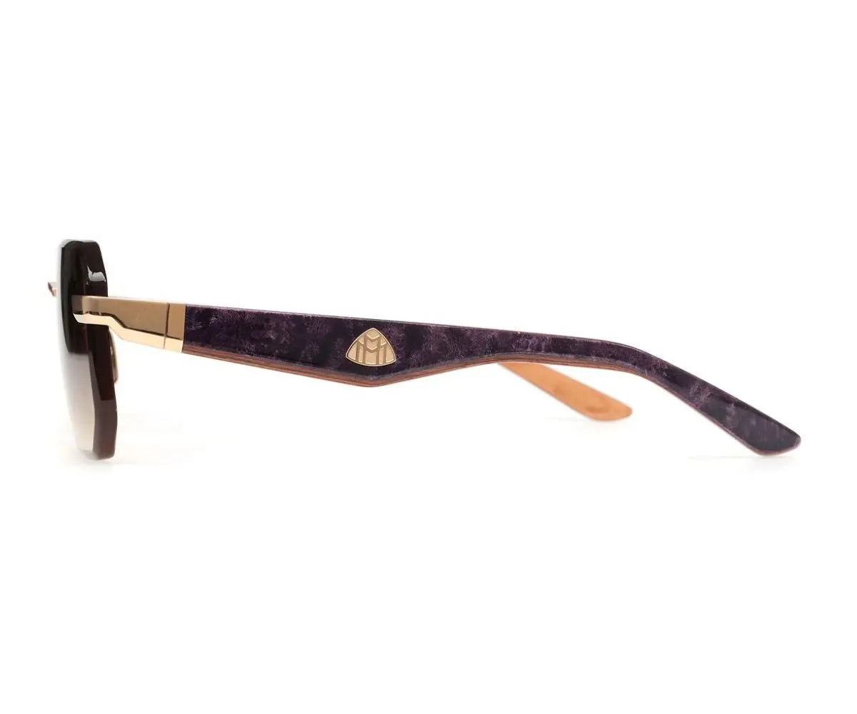 Sunglasses with a maroon frame and gold accents on a white background