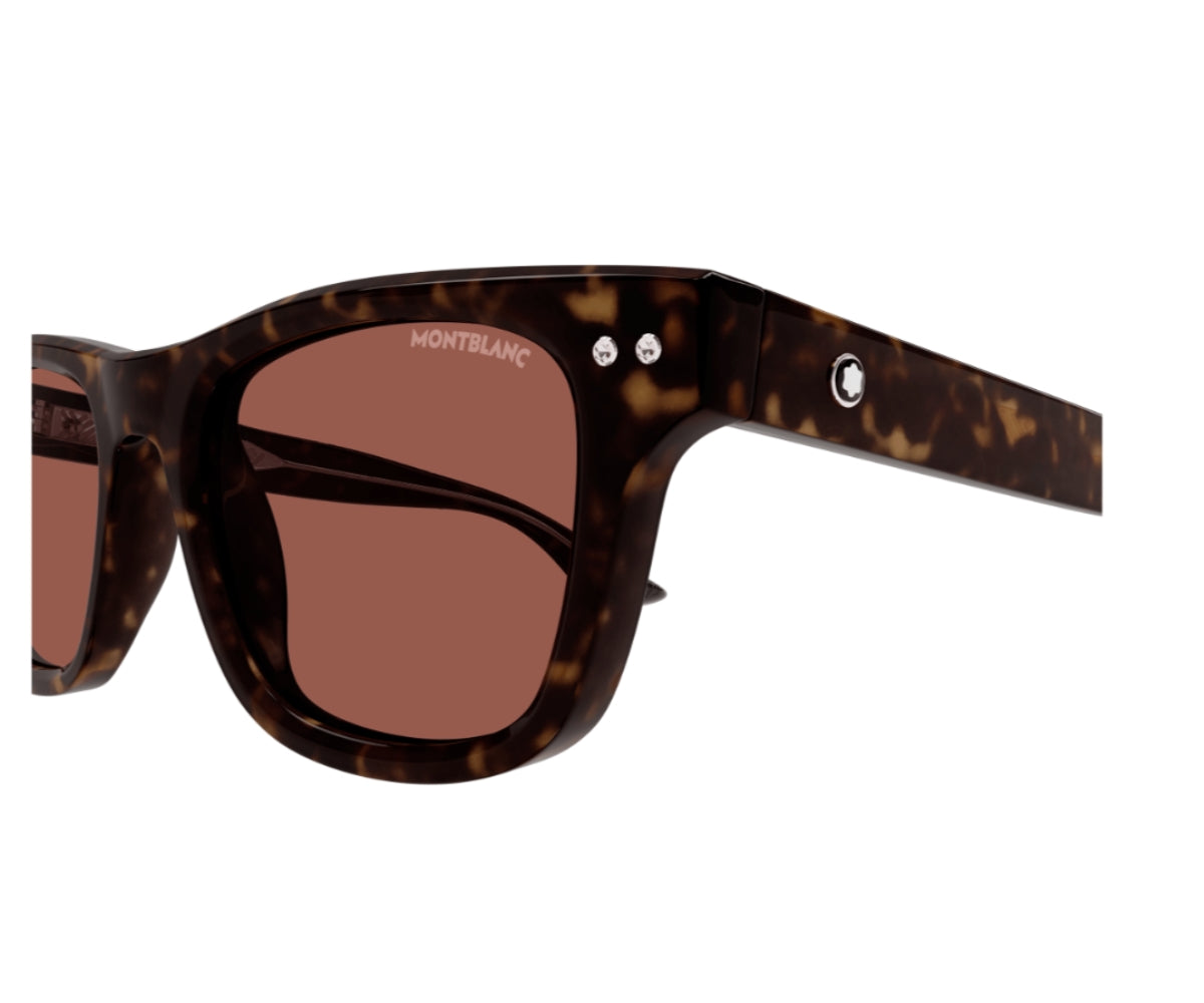 Sunglasses with tortoiseshell frame and brown lenses on a white background