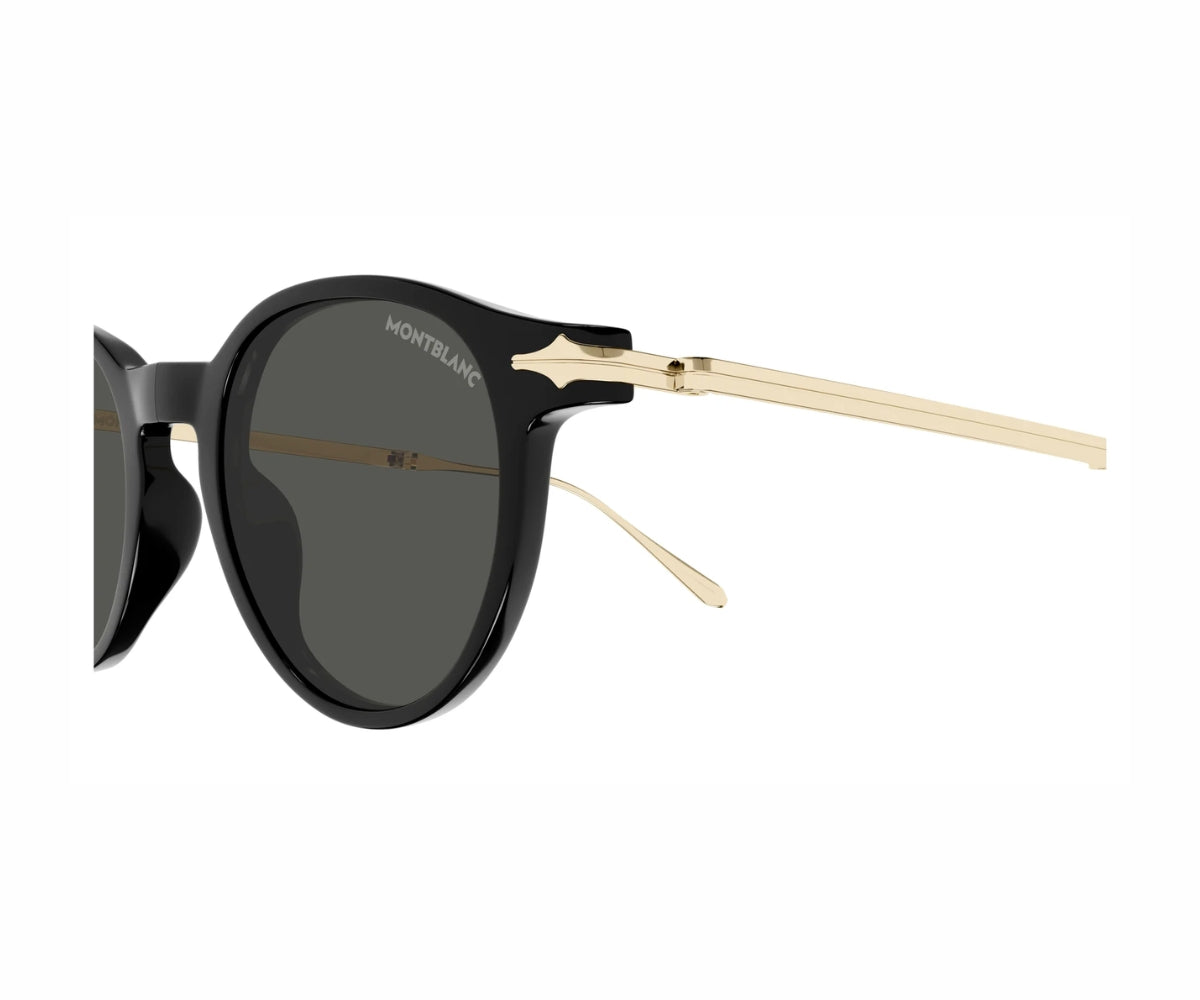 Sunglasses with black frame and gold accents on a white background