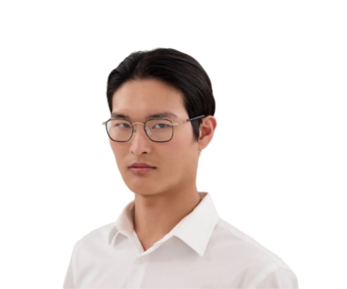 Man wearing glasses and a white shirt on a white background