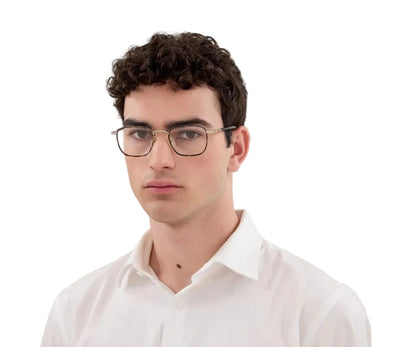 Man wearing glasses and a white shirt on a white background