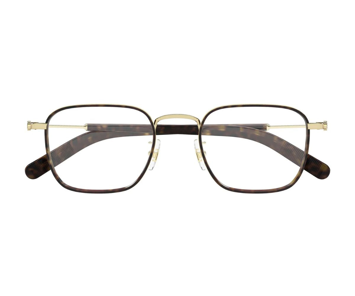 Pair of eyeglasses with gold frame and tortoiseshell arms on a white background