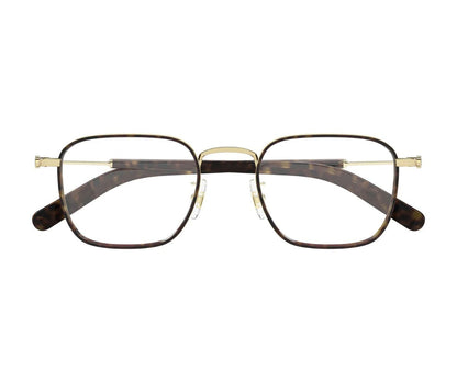 Pair of eyeglasses with gold frame and tortoiseshell arms on a white background