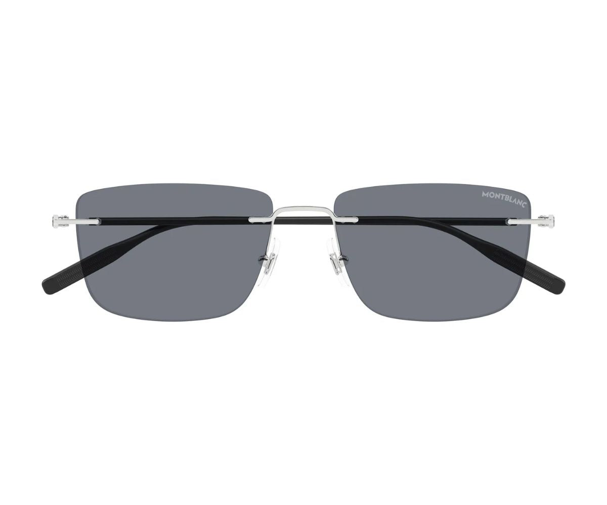 Sunglasses with a thin frame and dark lenses on a white background