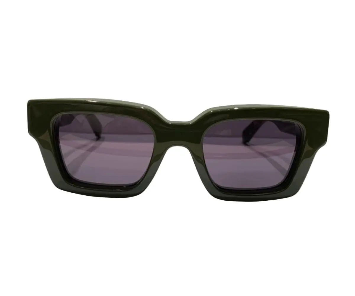 Green sunglasses with dark lenses on a white background
