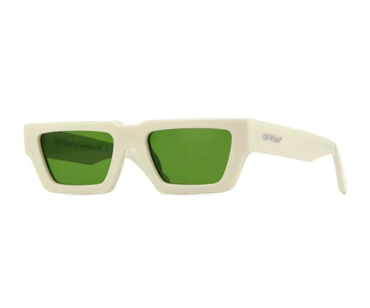 Sunglasses with green lenses and beige frame on a white background