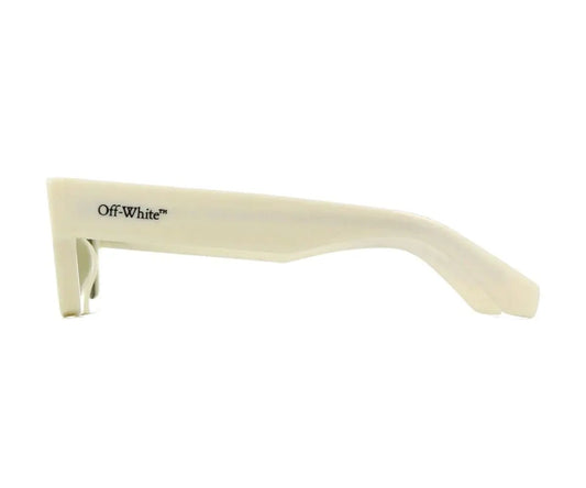 Beige sunglasses with a reflective surface on a white background
