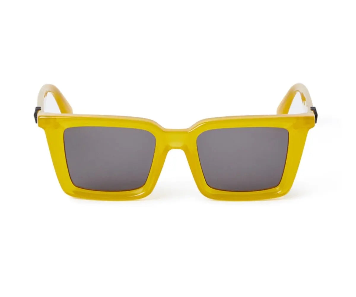 Yellow sunglasses with gray lenses on a white background