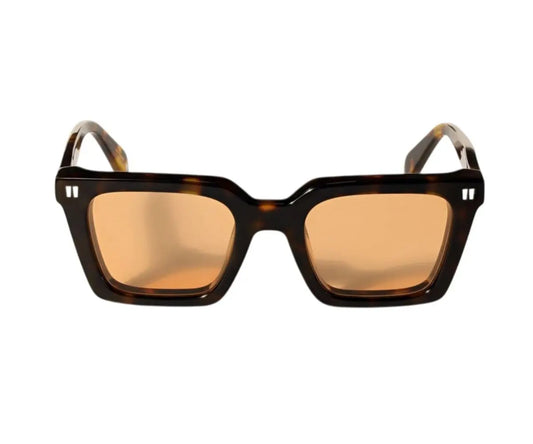 Sunglasses with tortoiseshell frame and brown lenses on a white background