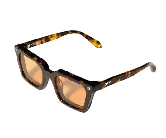 Sunglasses with tortoiseshell frame and orange lenses on a white background