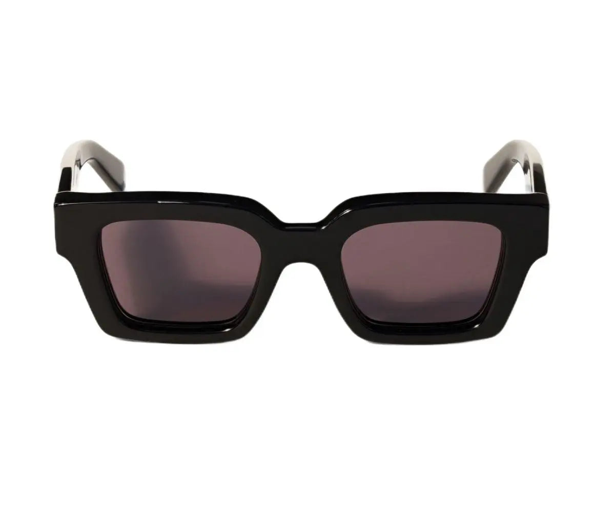Black sunglasses with a white frame on a white background