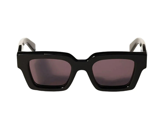Black sunglasses with a white frame on a white background